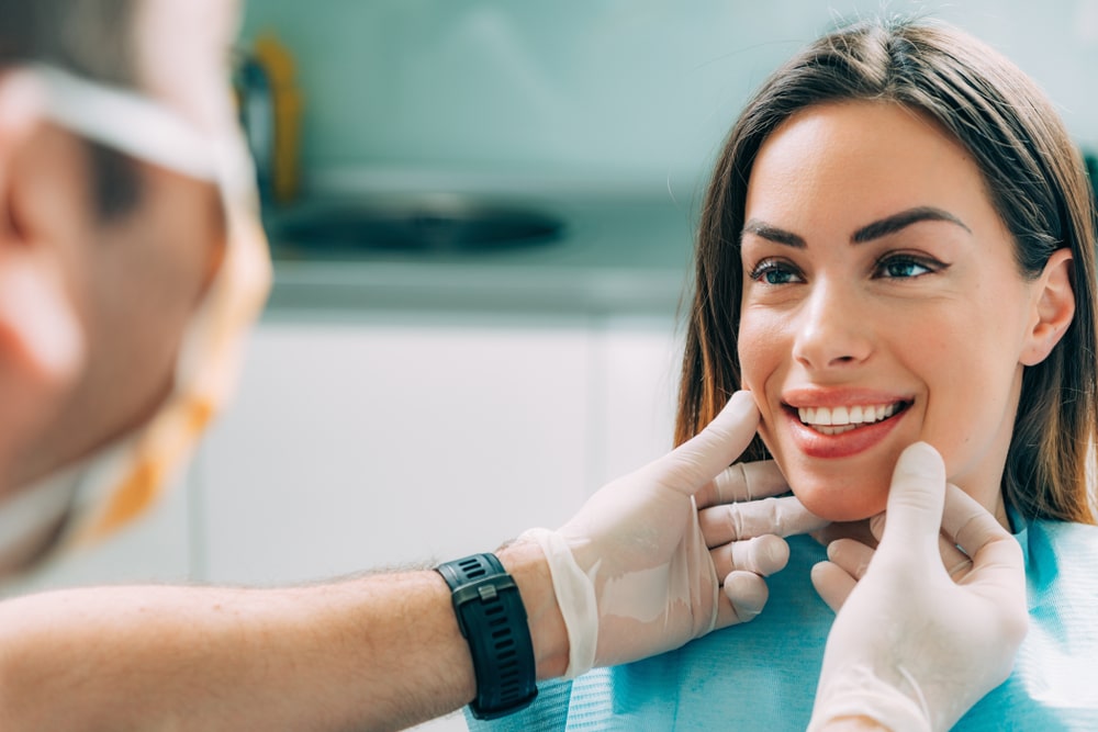 esthetician checking out a patient 