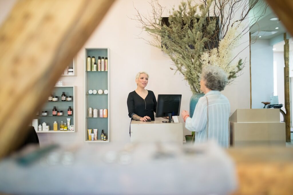 salon owner checking out a customer