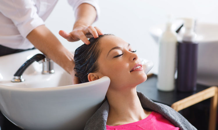 salon-spa-services woman at hair salon getting hair washed